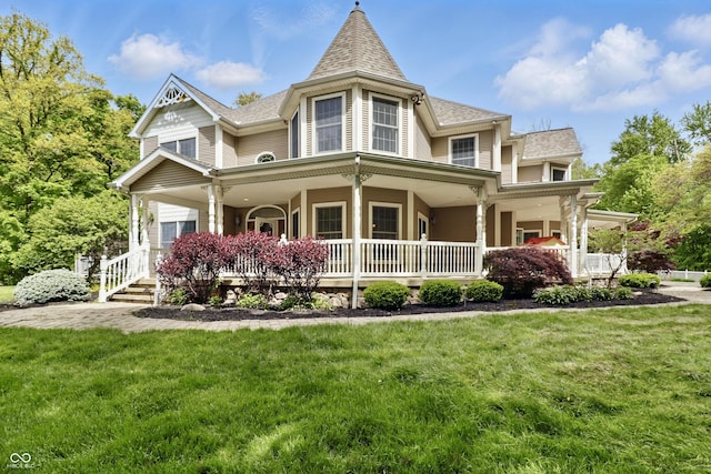 1478 W 500 S, Peru, IN 46970 - victorian house featuring covered porch, a front lawn, and a shingled roof
