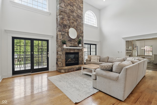 1478 W 500 S, Peru, IN 46970 - living area featuring a towering ceiling, wood finished floors, and a fireplace
