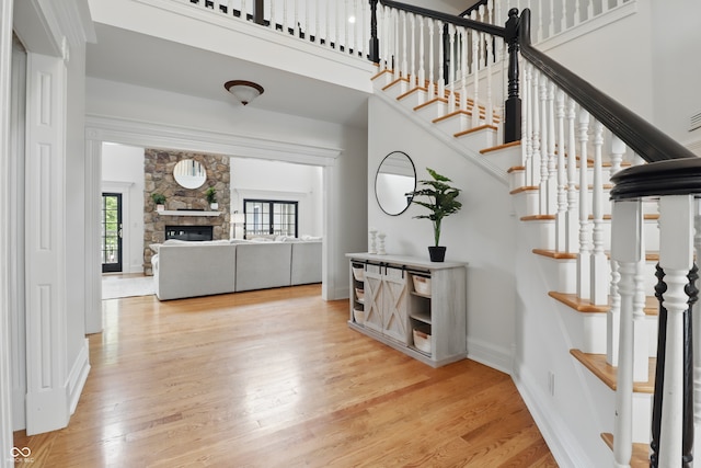 1478 W 500 S, Peru, IN 46970 - staircase featuring wood finished floors, baseboards, and a fireplace
