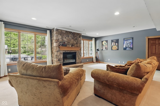 1478 W 500 S, Peru, IN 46970 - living room featuring light colored carpet, a stone fireplace, baseboards, and recessed lighting