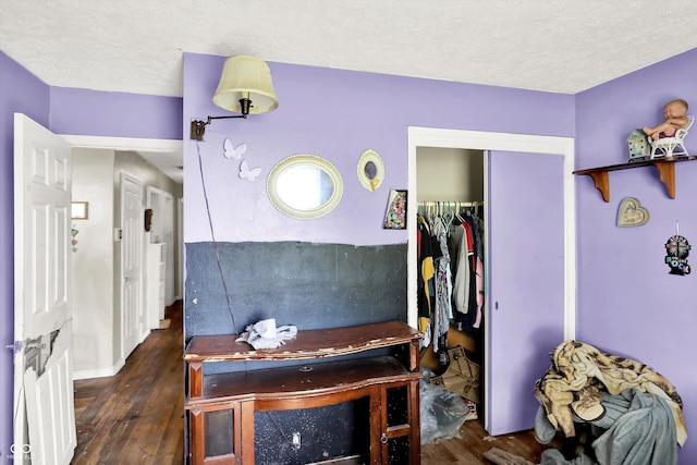 2200 N Dixon Rd, Kokomo, IN 46901 - bedroom with wood finished floors, a closet, and a textured ceiling