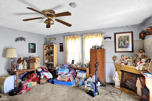 2200 N Dixon Rd, Kokomo, IN 46901 - rec room with a textured ceiling, a ceiling fan, and carpet floors
