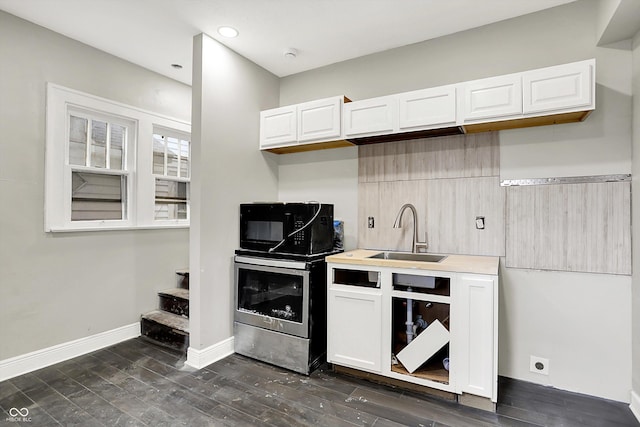 1033 N Dearborn St, Indianapolis, IN 46201 - kitchen featuring a sink, black microwave, white cabinetry, dark wood-style flooring, and recessed lighting