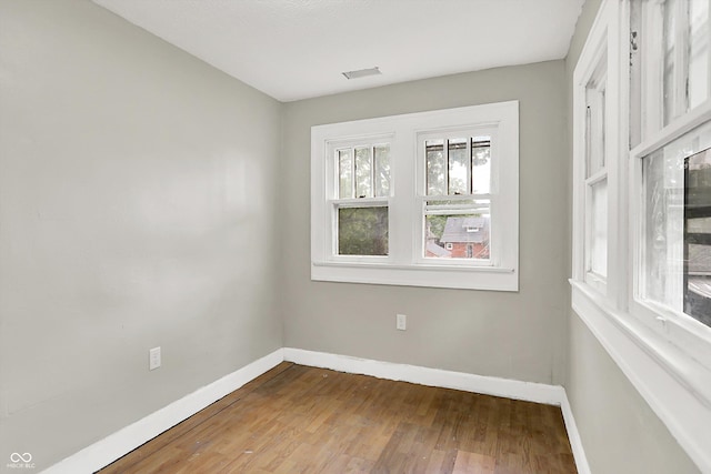 1033 N Dearborn St, Indianapolis, IN 46201 - unfurnished room featuring baseboards and wood finished floors