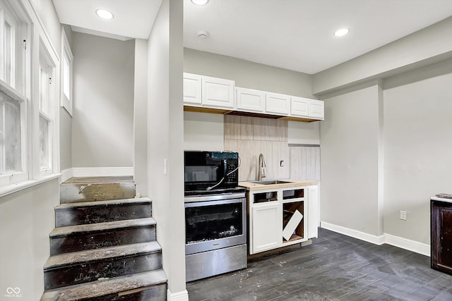 1033 N Dearborn St, Indianapolis, IN 46201 - kitchen featuring a sink, white cabinetry, dark wood-style flooring, recessed lighting, and baseboards