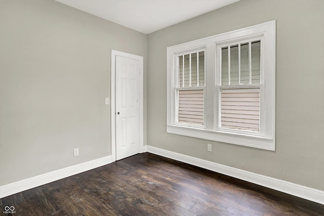 1033 N Dearborn St, Indianapolis, IN 46201 - empty room with baseboards and dark wood finished floors