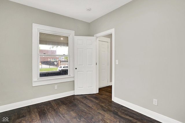 1033 N Dearborn St, Indianapolis, IN 46201 - unfurnished room with baseboards and dark wood-type flooring