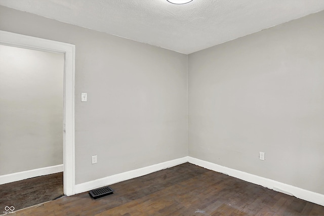 1033 N Dearborn St, Indianapolis, IN 46201 - empty room with baseboards and dark wood-style flooring