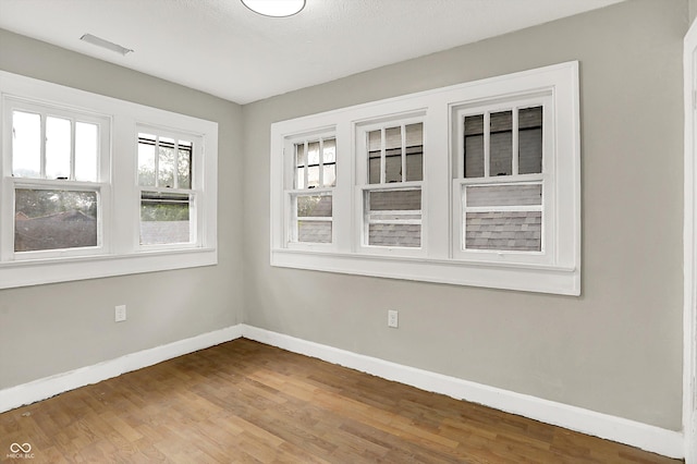 1033 N Dearborn St, Indianapolis, IN 46201 - unfurnished room with baseboards and wood finished floors
