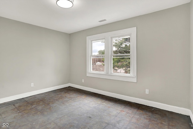 1033 N Dearborn St, Indianapolis, IN 46201 - spare room featuring baseboards and stone finish floors