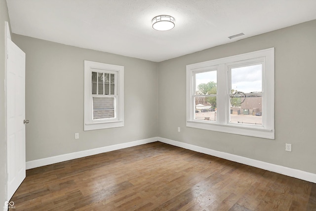 1033 N Dearborn St, Indianapolis, IN 46201 - unfurnished room featuring wood finished floors and baseboards
