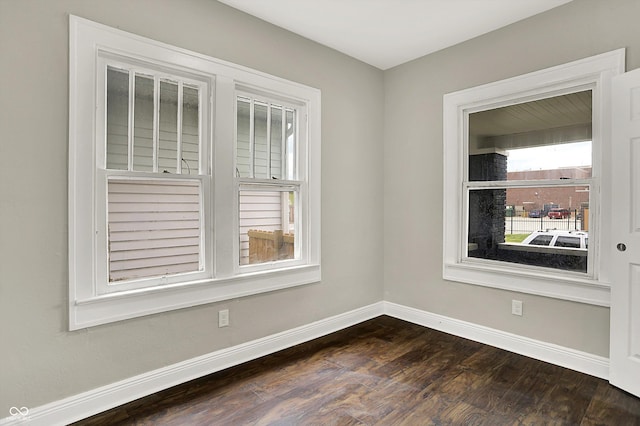 1033 N Dearborn St, Indianapolis, IN 46201 - empty room featuring baseboards and dark wood finished floors