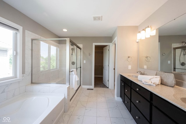 full bathroom featuring a shower stall, marble look tiles, a bath, double vanity, and recessed lighting