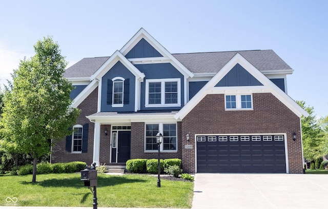 view of front facade featuring concrete driveway, a front yard, an attached garage, and brick siding