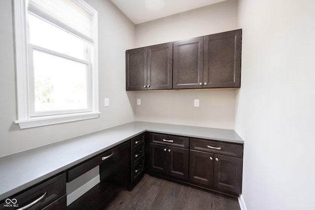 unfurnished office with dark wood-style floors