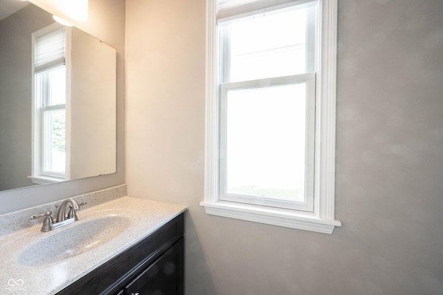bathroom featuring healthy amount of natural light and vanity