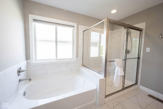 full bath featuring a garden tub, a stall shower, baseboards, recessed lighting, and marble look tile flooring