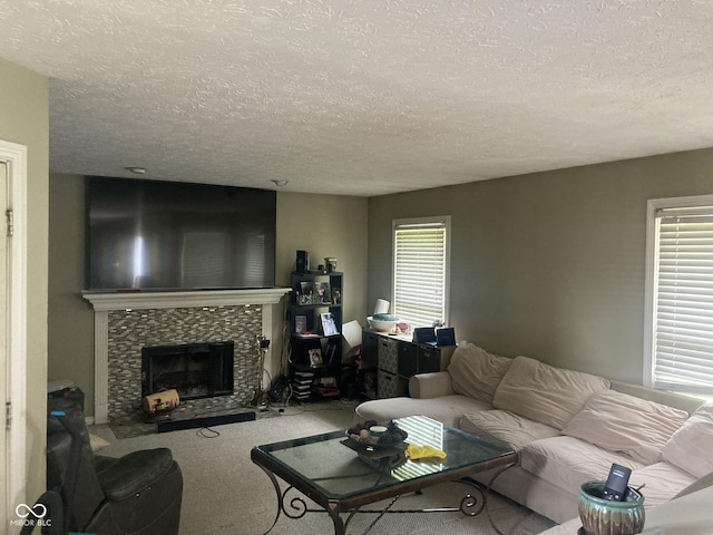 11458 Sutton Place Dr W, Carmel, IN 46032 - carpeted living area featuring a textured ceiling and a fireplace