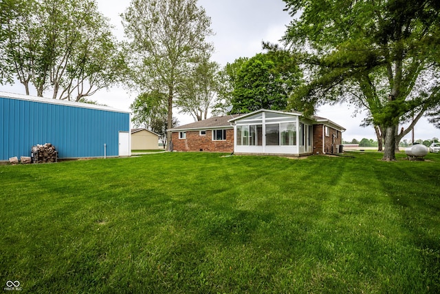 2965 E 1100 N, Pendleton, IN 46064 - view of green lawn with a sunroom, a pole building, and an outbuilding