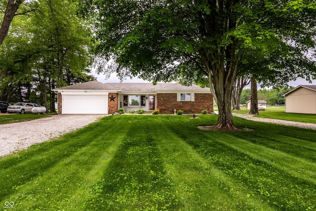 2965 E 1100 N, Pendleton, IN 46064 - ranch-style home featuring gravel driveway, a garage, brick siding, and a front yard