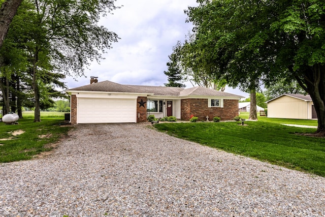 2965 E 1100 N, Pendleton, IN 46064 - ranch-style house with gravel driveway, an attached garage, brick siding, a front yard, and a chimney