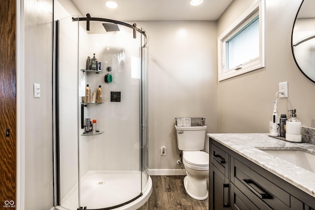 2965 E 1100 N, Pendleton, IN 46064 - bathroom with wood finished floors, a shower stall, baseboards, toilet, and vanity