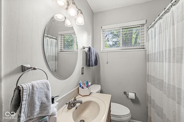 5427 Heights Ave, Indianapolis, IN 46237 - bathroom with toilet, vanity, and a shower with curtain