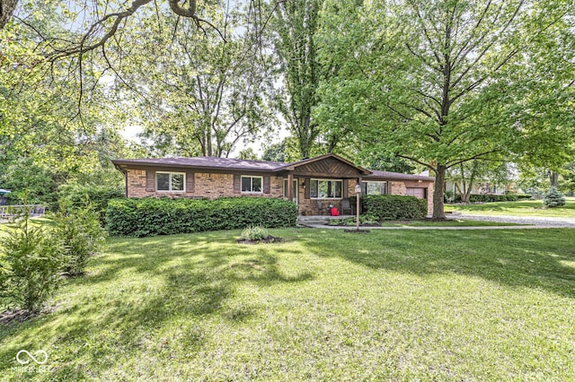 5427 Heights Ave, Indianapolis, IN 46237 - ranch-style home with a front lawn, brick siding, and a garage