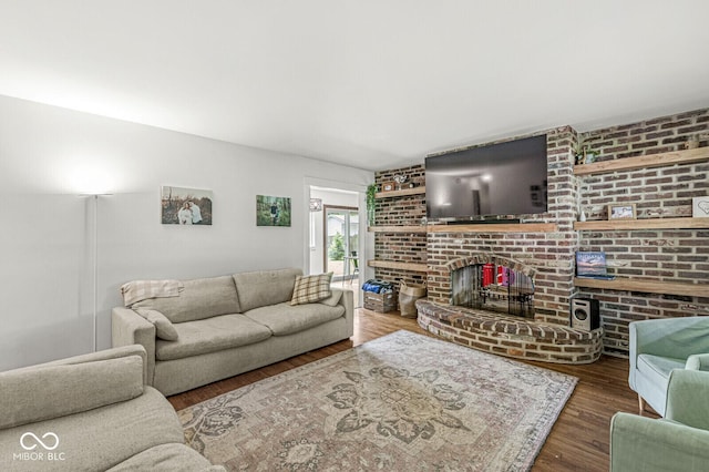 5427 Heights Ave, Indianapolis, IN 46237 - living area featuring wood finished floors and a brick fireplace