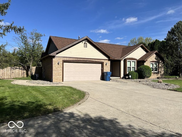 6143 Roberts Pl, Indianapolis, IN 46220 - single story home featuring an attached garage, brick siding, and concrete driveway