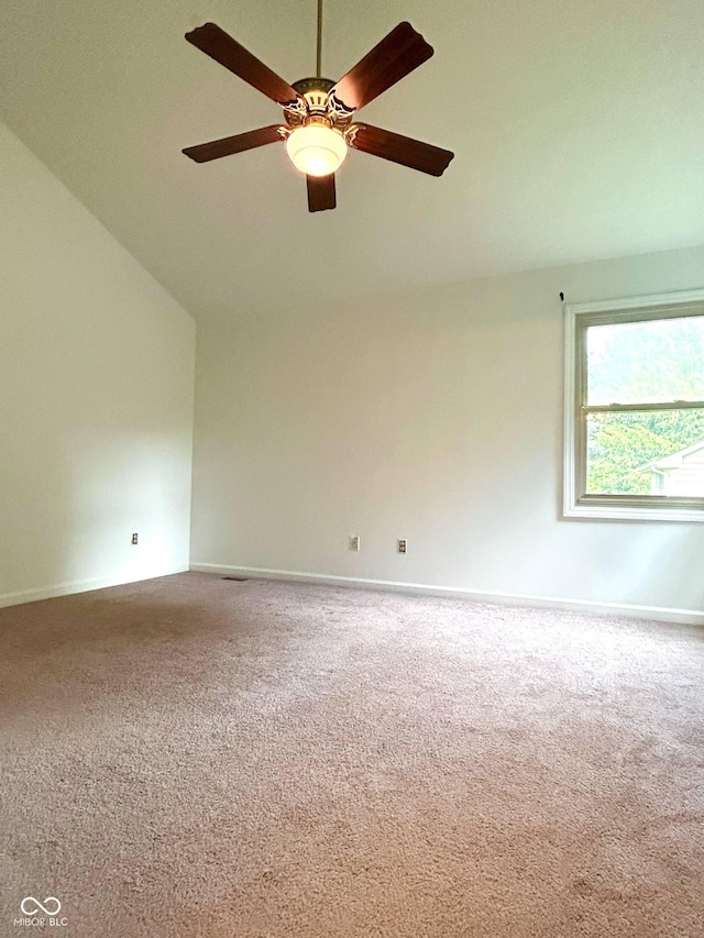 6143 Roberts Pl, Indianapolis, IN 46220 - spare room featuring carpet flooring, lofted ceiling, a ceiling fan, and baseboards