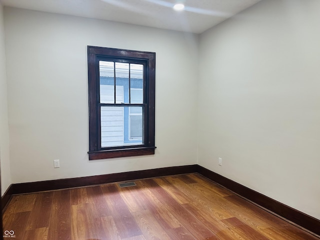 1718 Thaddeus St, Indianapolis, IN 46203 - unfurnished room featuring baseboards and wood finished floors