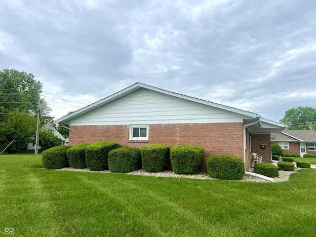 2508 Pamela Ct, Anderson, IN 46012 - view of side of home featuring brick siding and a lawn