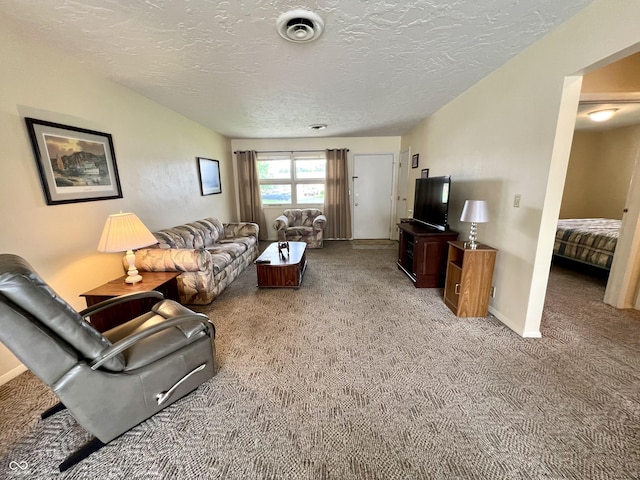 2508 Pamela Ct, Anderson, IN 46012 - living room featuring light colored carpet, a textured ceiling, and baseboards