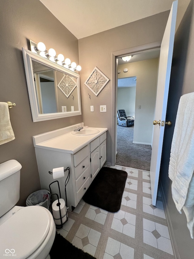 2508 Pamela Ct, Anderson, IN 46012 - bathroom featuring vanity, toilet, and tile patterned floors