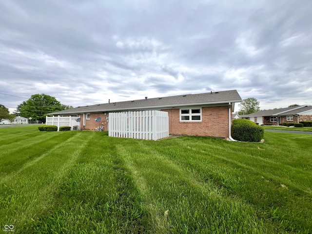 2508 Pamela Ct, Anderson, IN 46012 - back of house featuring brick siding and a yard