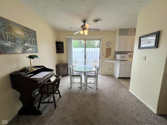 2508 Pamela Ct, Anderson, IN 46012 - carpeted dining area featuring ceiling fan, baseboards, a textured ceiling, and an office area