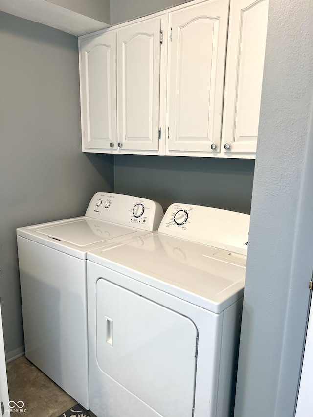 2508 Pamela Ct, Anderson, IN 46012 - laundry area featuring washing machine and clothes dryer and cabinet space