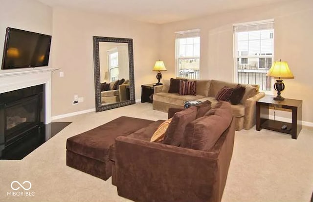 6304 El Paso St, Whitestown, IN 46075 - living room featuring carpet flooring, baseboards, and a fireplace with flush hearth