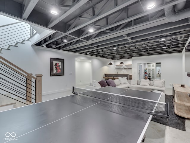 game room with baseboards