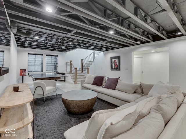 living room featuring stairway