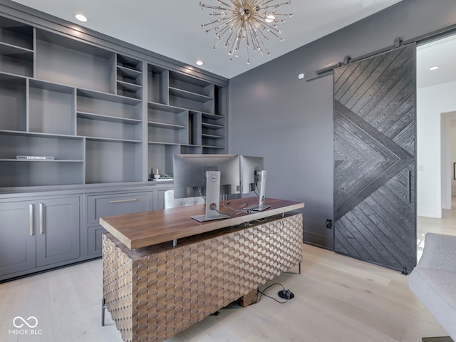 office area featuring a barn door, light wood-style floors, a chandelier, and recessed lighting