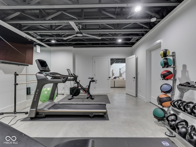 workout area featuring baseboards