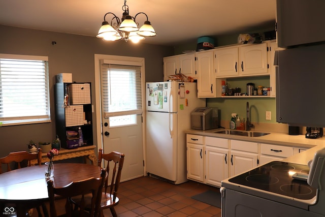 706 Bobs Ct, Beech Grove, IN 46107 - kitchen with a sink, electric range, freestanding refrigerator, dark tile patterned floors, and white cabinets