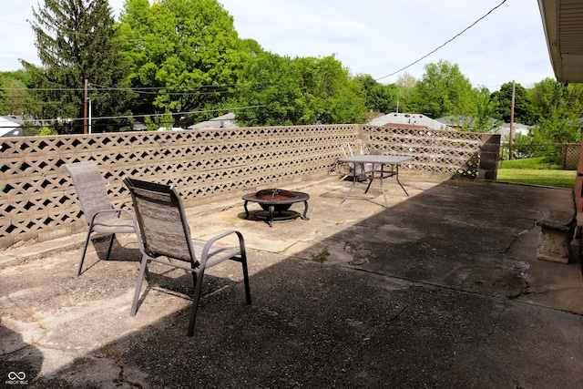 706 Bobs Ct, Beech Grove, IN 46107 - view of patio featuring a fire pit and fence