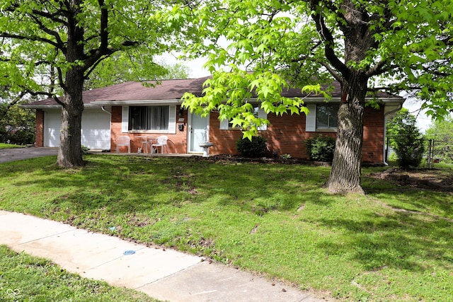 706 Bobs Ct, Beech Grove, IN 46107 - ranch-style house with brick siding, a garage, and driveway