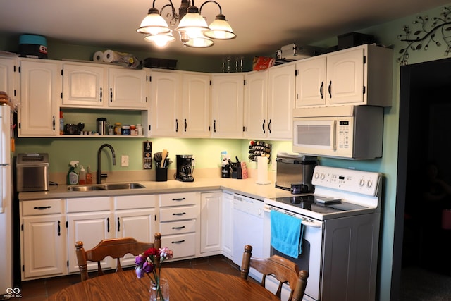 706 Bobs Ct, Beech Grove, IN 46107 - kitchen with white appliances, a sink, white cabinetry, and a chandelier