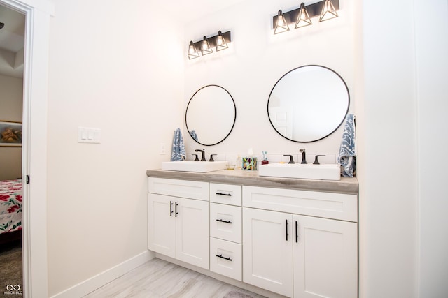 2686 Lafayette Ave, Columbus, IN 47201 - full bath with ensuite bath, baseboards, and double vanity