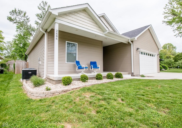 2686 Lafayette Ave, Columbus, IN 47201 - view of front of property featuring covered porch, a garage, driveway, and central AC