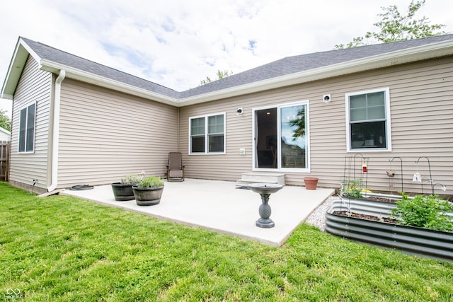 2686 Lafayette Ave, Columbus, IN 47201 - rear view of house featuring a patio area and a lawn